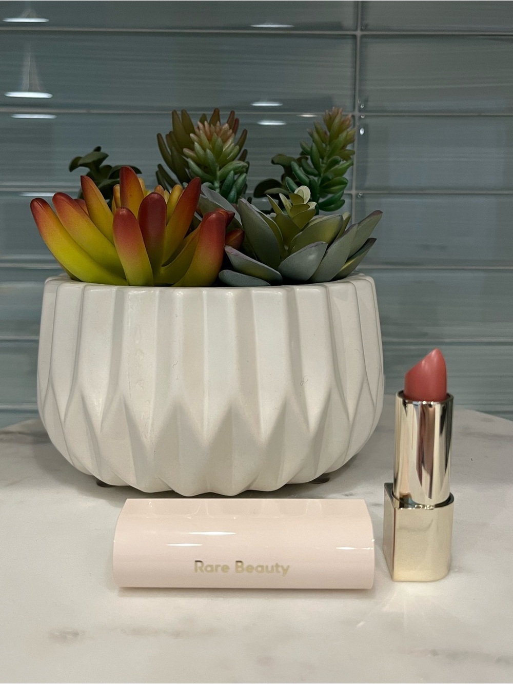Rare Beauty Lipstick in Soft Coral Pink with Gold Accents